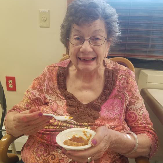 Image of Elderly woman eating at Kadima at Lakeside Nursing and Rehabilitation Facility
