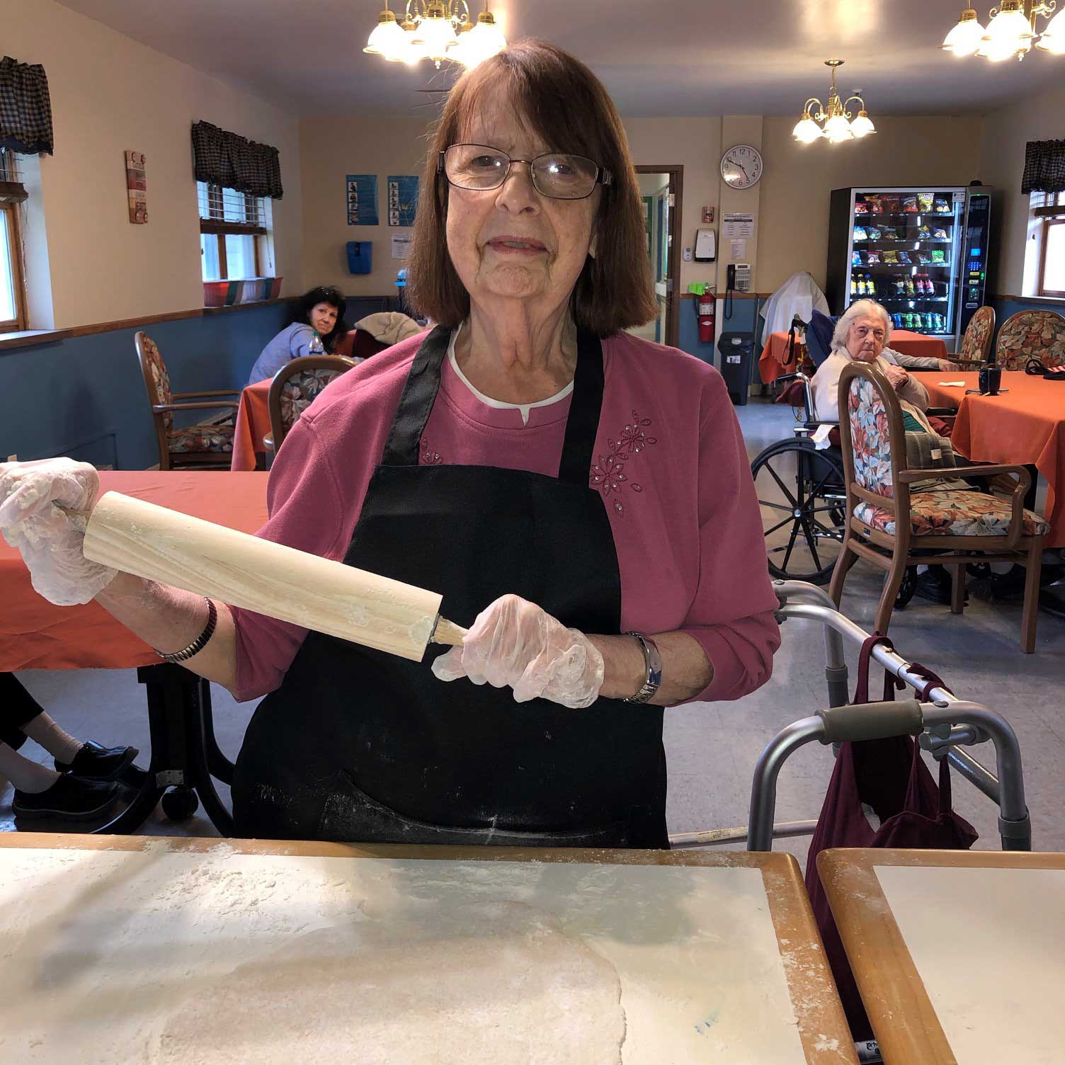 Image of senior woman baking at Kadima at Luzerne Nursing and Rehabilitation Facility
