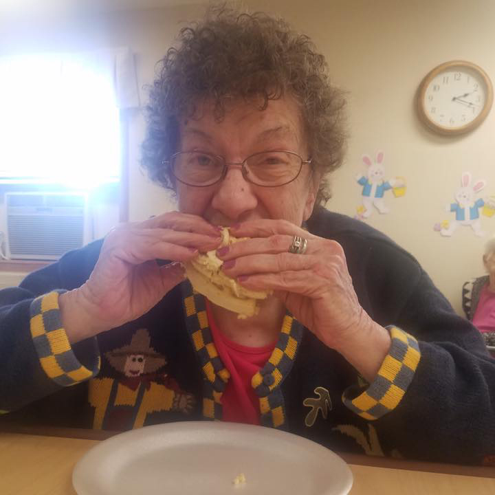 Image of resident woman eating at Kadima at Lakeside Nursing and Rehabilitation Facility