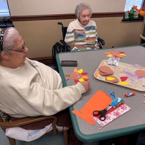 Image of elderly women doing arts and crafts at Kadima at Lititz Nursing and Rehabilitation Facility