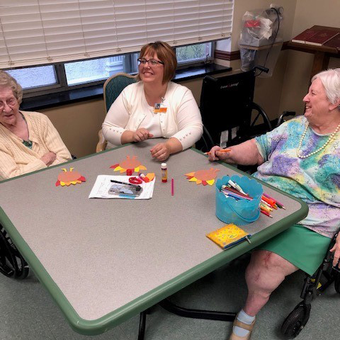 Image of elderly women doing arts and crafts at Kadima at Lititz Nursing and Rehabilitation Facility
